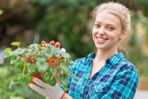 Front view of a gardener assessing a garden bed